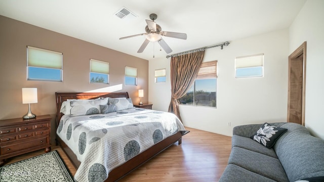 bedroom with ceiling fan and light wood-type flooring