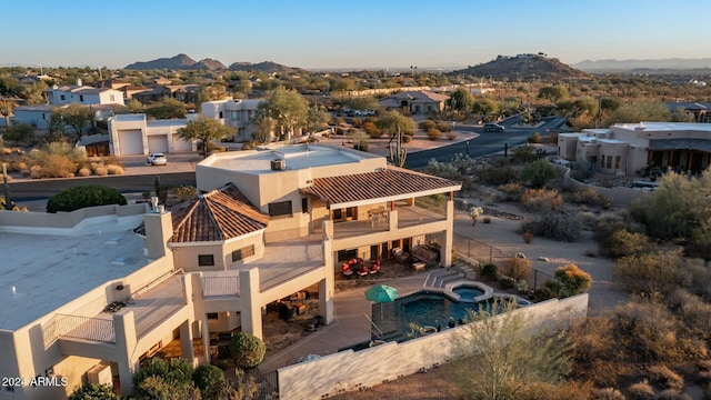 birds eye view of property with a mountain view