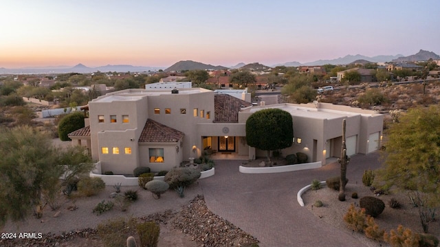 pueblo-style home featuring a mountain view