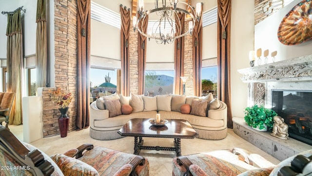 living room with a fireplace and an inviting chandelier