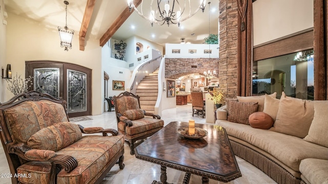 interior space featuring beam ceiling, light tile patterned flooring, a high ceiling, and an inviting chandelier