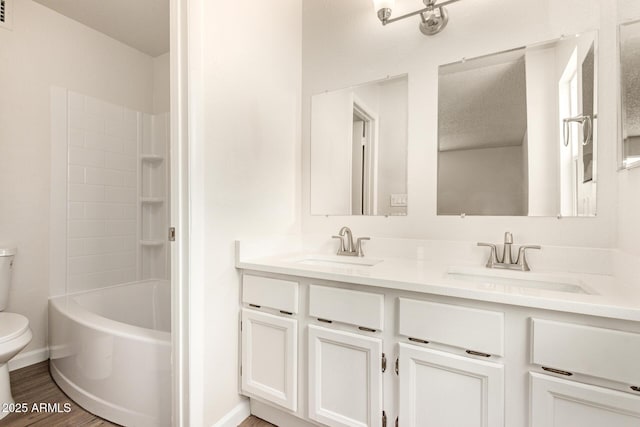 2318 N 87th Ave, Phoenix, AZ 85037 - bathroom featuring double vanity, wood finished floors, and shower / bathtub combination