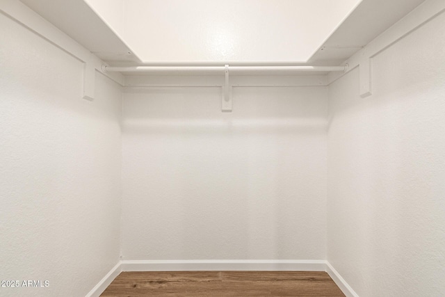 2318 N 87th Ave, Phoenix, AZ 85037 - spacious closet with wood finished floors