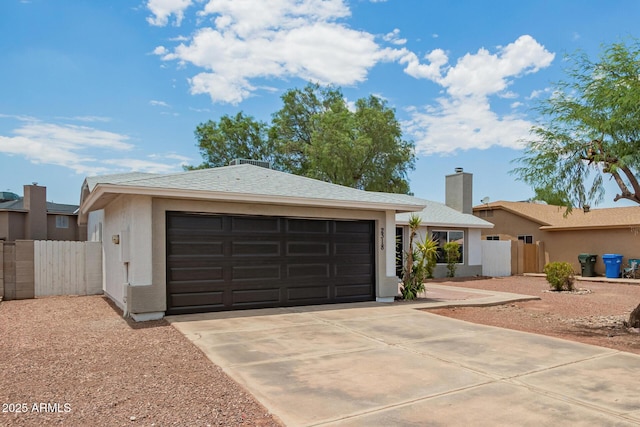 2318 N 87th Ave, Phoenix, AZ 85037 - ranch-style home with concrete driveway, a chimney, an attached garage, and stucco siding
