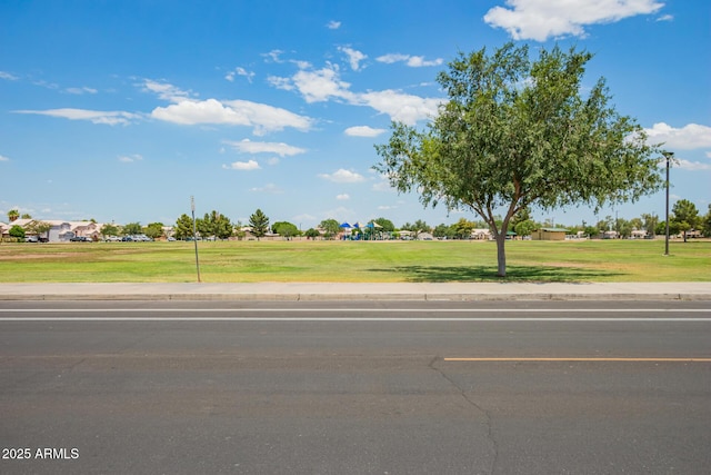 2318 N 87th Ave, Phoenix, AZ 85037 - view of asphalt street featuring sidewalks