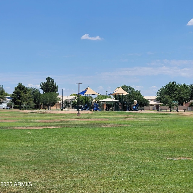 2318 N 87th Ave, Phoenix, AZ 85037 - view of property's community with a yard