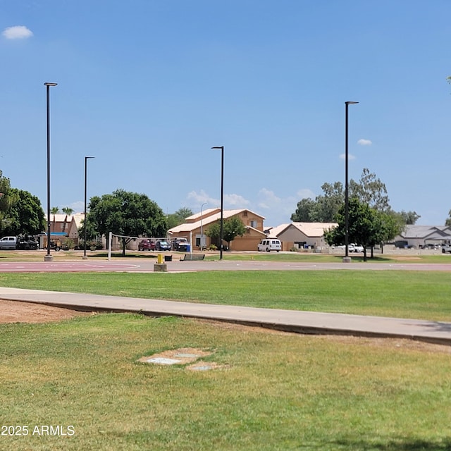 2318 N 87th Ave, Phoenix, AZ 85037 - view of home's community featuring a yard