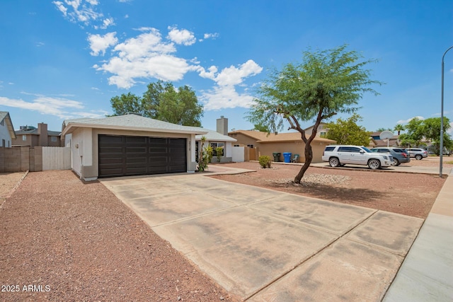 2318 N 87th Ave, Phoenix, AZ 85037 - single story home with a garage, driveway, a chimney, and stucco siding