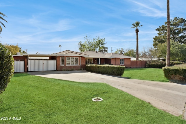 ranch-style home featuring a carport and a front lawn