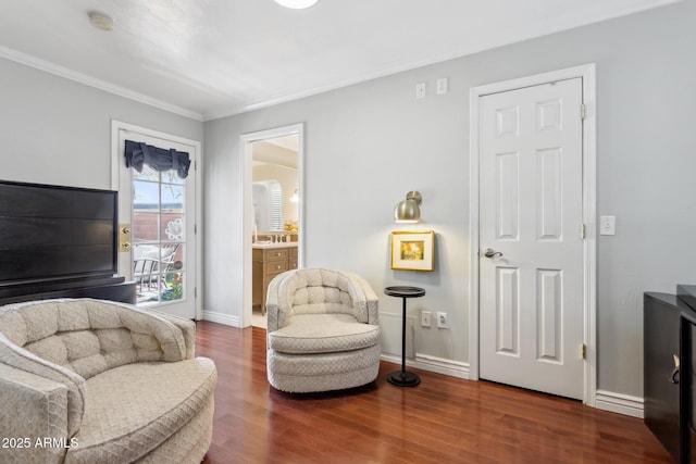 sitting room featuring crown molding and wood-type flooring