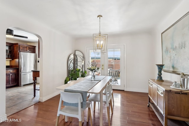 dining room featuring dark hardwood / wood-style floors and a chandelier