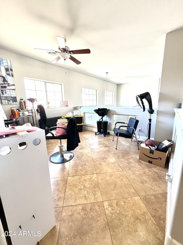 tiled living room featuring ceiling fan