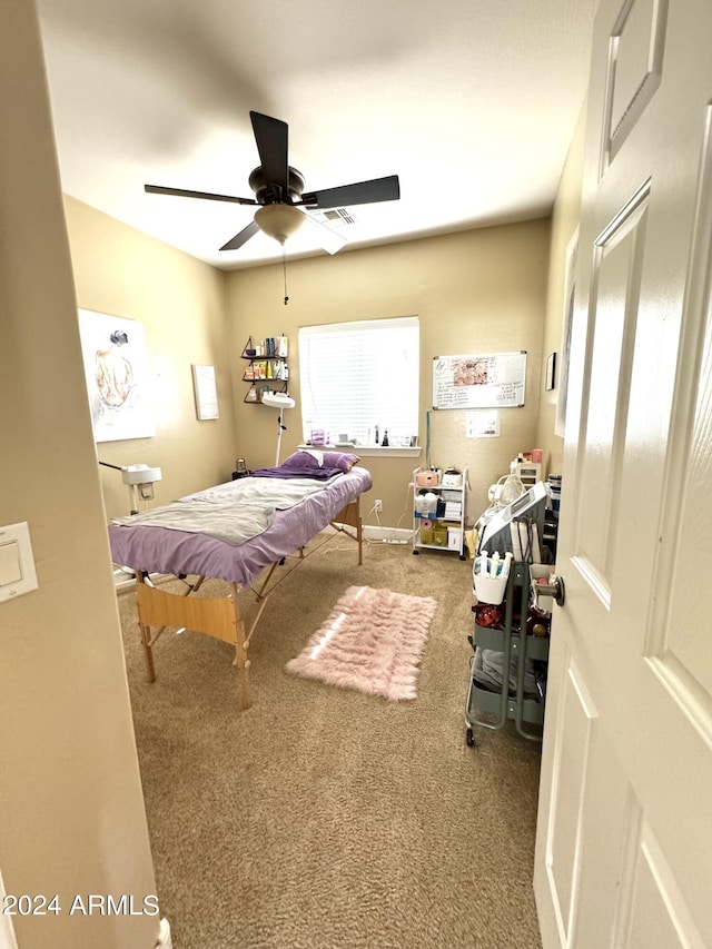 carpeted bedroom featuring ceiling fan