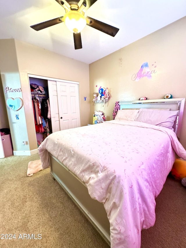 carpeted bedroom featuring ceiling fan and a closet