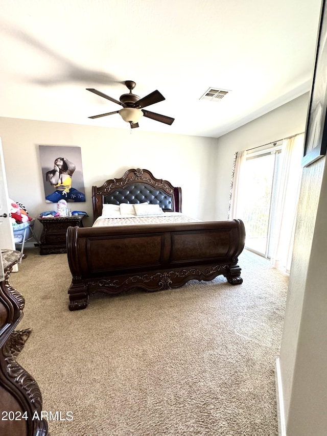 carpeted bedroom with ceiling fan and access to exterior