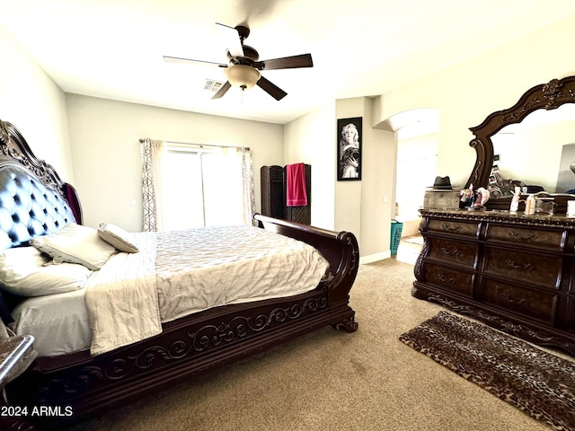 bedroom with light colored carpet and ceiling fan