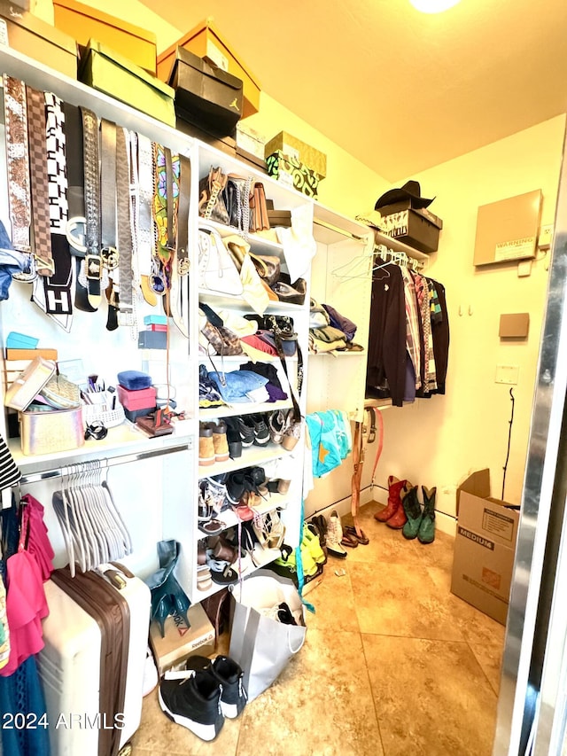 spacious closet with tile patterned flooring