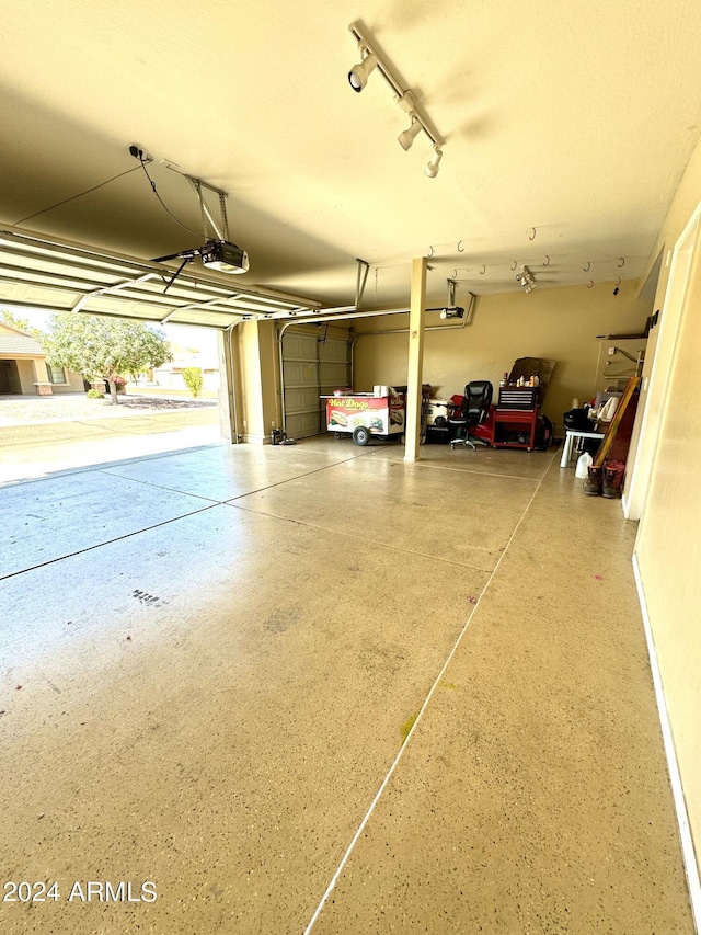 garage featuring a garage door opener