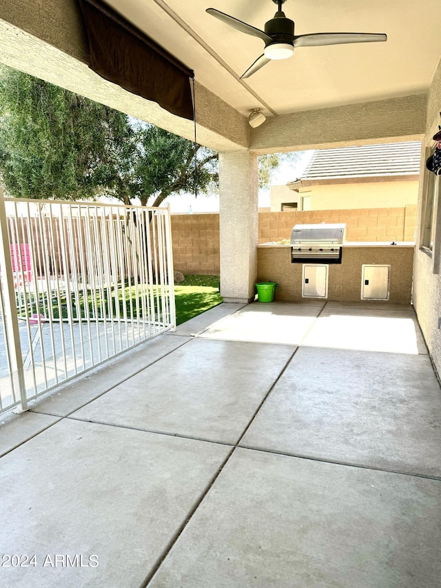 view of patio featuring ceiling fan and area for grilling