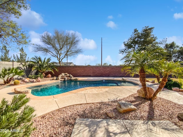 view of swimming pool with a patio, a fenced backyard, and a fenced in pool