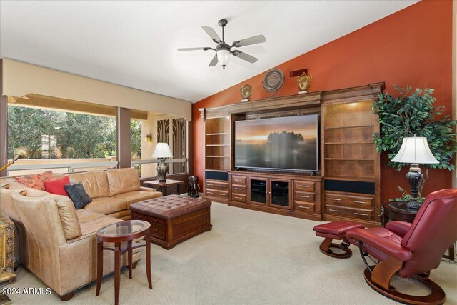 living room with carpet, vaulted ceiling, and ceiling fan