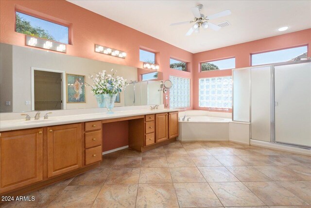 bathroom featuring independent shower and bath, vanity, and ceiling fan