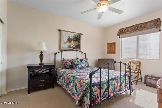 bedroom with ceiling fan and carpet flooring