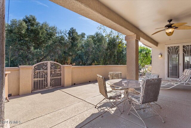 view of patio / terrace featuring ceiling fan