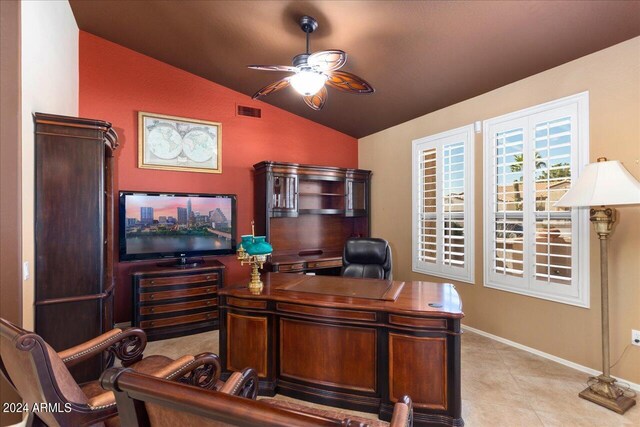 tiled office space with ceiling fan and lofted ceiling