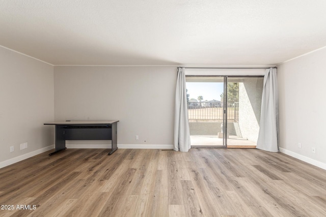 spare room with light wood-type flooring