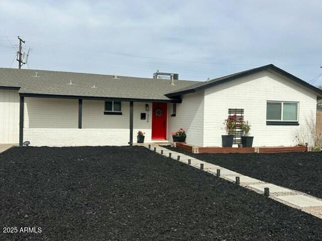 ranch-style house featuring a garage