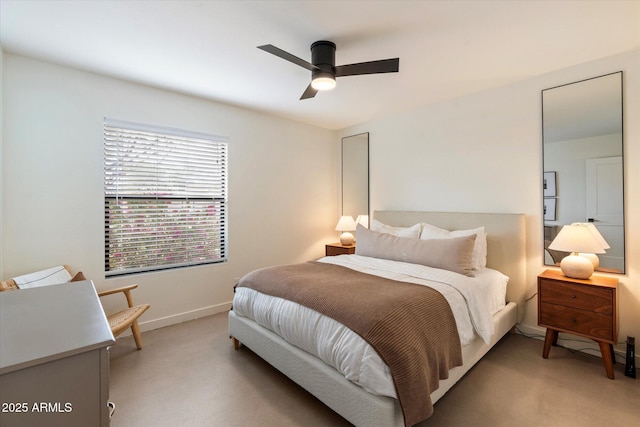 bedroom featuring light carpet and ceiling fan