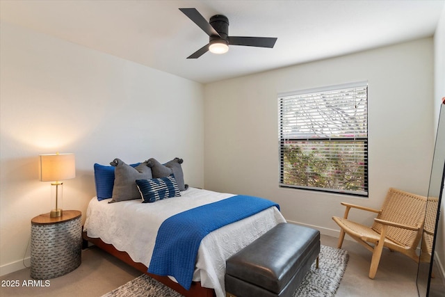 bedroom with ceiling fan and carpet