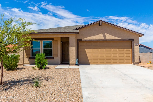 ranch-style house featuring a garage