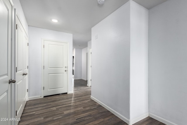 hall with dark hardwood / wood-style floors