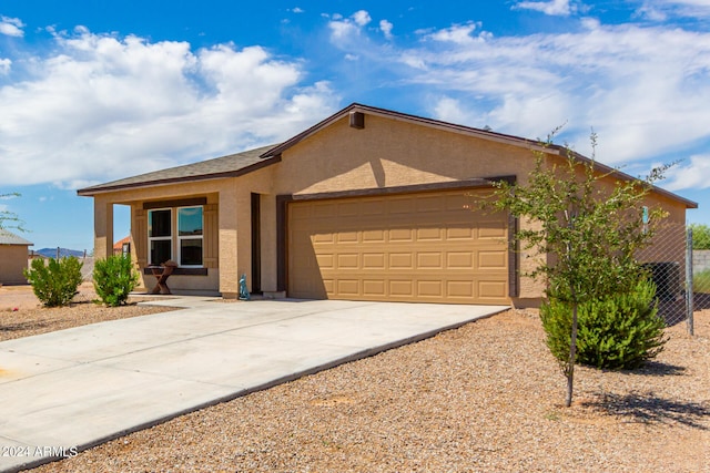 ranch-style house featuring a garage