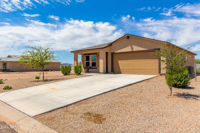 single story home featuring a garage