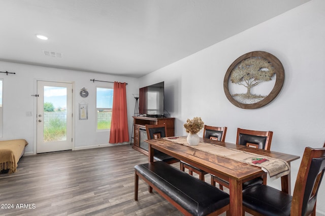 dining space with dark wood-type flooring