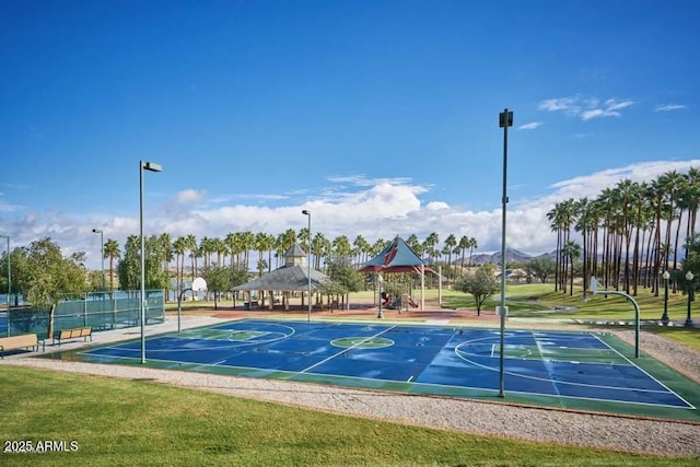 view of sport court with a gazebo, community basketball court, fence, and a lawn
