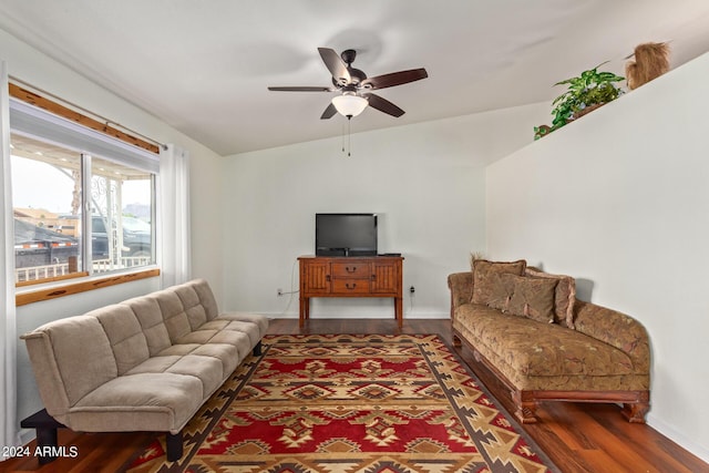 living room with dark hardwood / wood-style floors, ceiling fan, and lofted ceiling