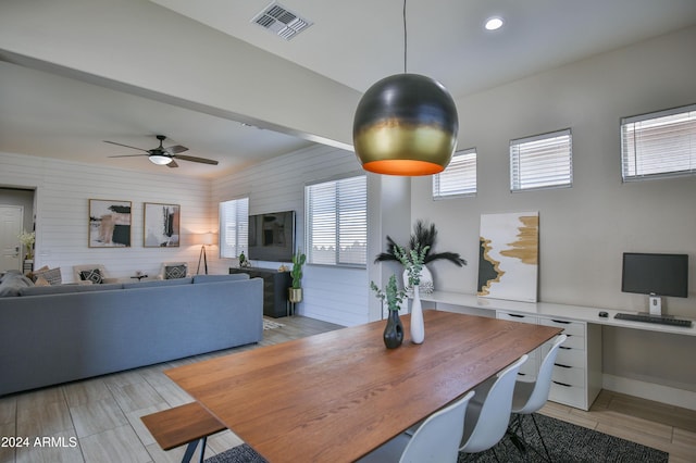 dining room with ceiling fan and light hardwood / wood-style floors