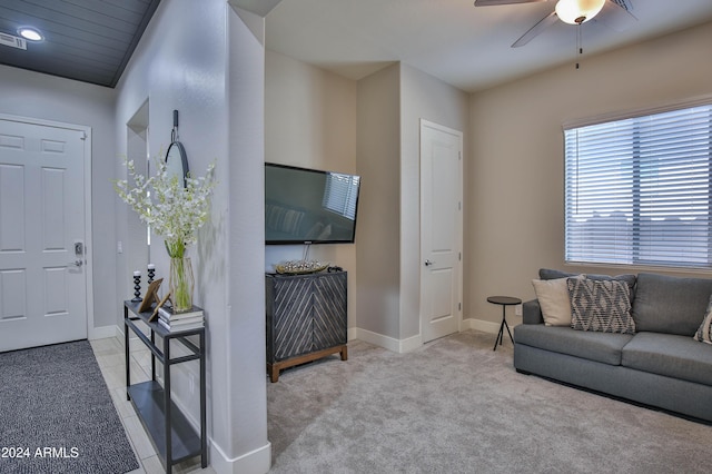 living room featuring ceiling fan and light carpet