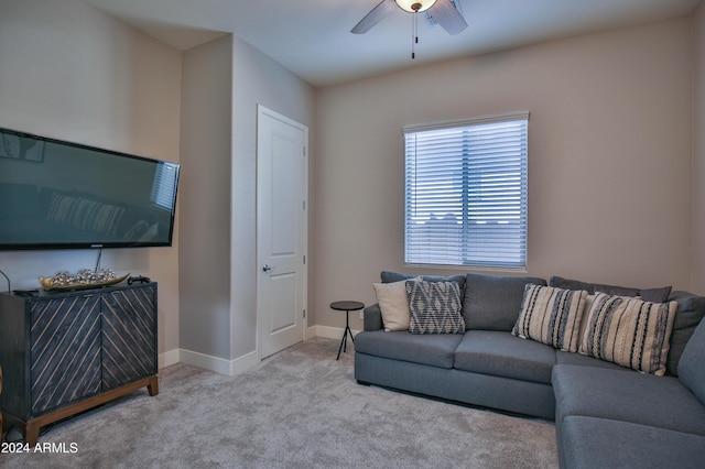 carpeted living room with ceiling fan