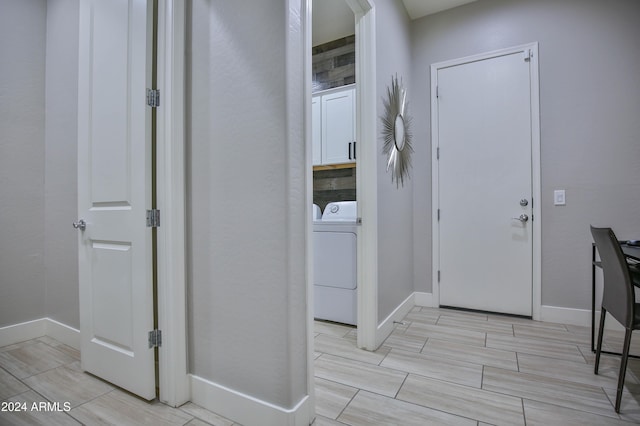 hallway with washer / dryer