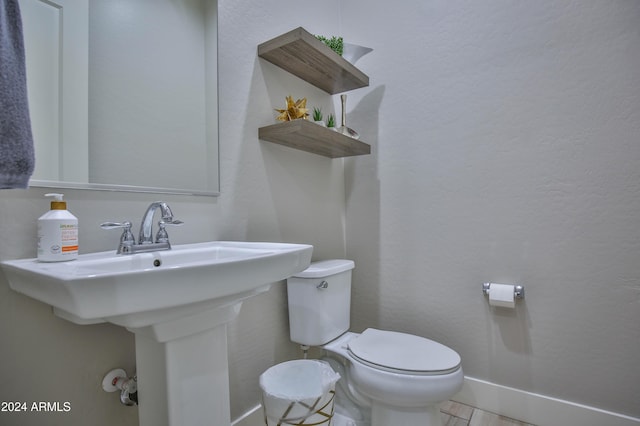 bathroom with toilet and sink