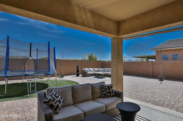 view of patio / terrace with an outdoor living space and a trampoline