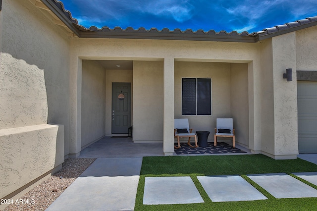 entrance to property featuring a patio