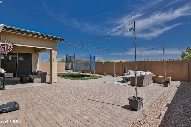 view of patio featuring an outdoor living space and a trampoline