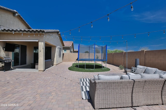 view of patio / terrace featuring a grill, an outdoor hangout area, and a trampoline