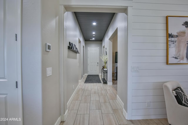 hallway with light hardwood / wood-style flooring